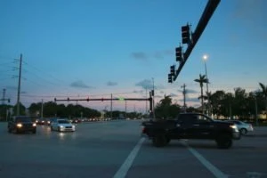 Vehicles making a turn at a Florida intersection.