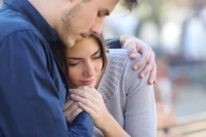 young couple grieving