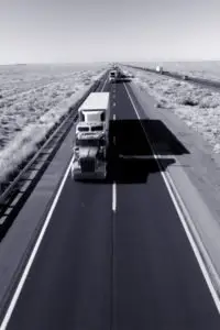 black and white photo of a freight truck