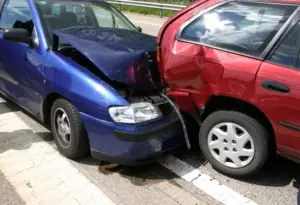 blue car smashed into red car