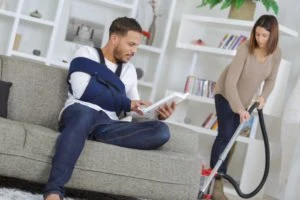 guy with broken arm sitting on the couch