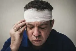 man with a bandaged head