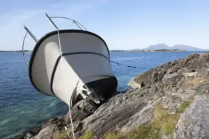 recreational boat on the rocks