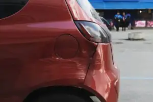 side-impact damage on a red car