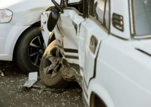 white cars smashed into each other