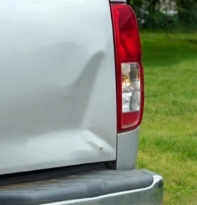 dented back end of a truck