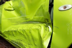 side-impact damage to green car