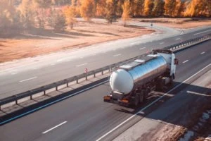 fuel tanker truck travels along highway