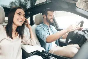 man and woman driving together