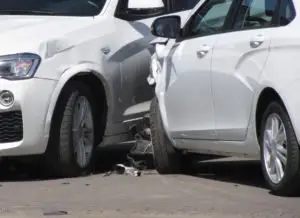 two cars are damaged after a side-impact collision