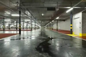 wet parking lot with no wet floor warning sign