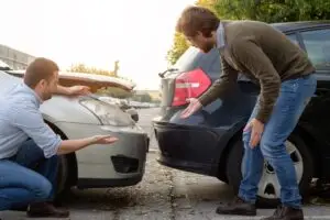 Inspecting a car after an accident.