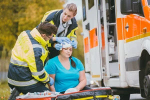 medics treat wounded woman