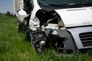 smashed white semi-truck bumper