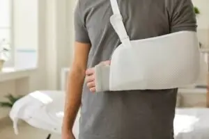 Man with broken arm in cast.