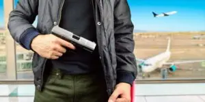 man-with-a-gun-at-the-airport