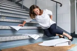 woman falling down stairs.