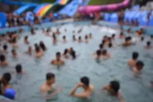 blurry-photo-of-many-people-in-a-pool-in-roseville