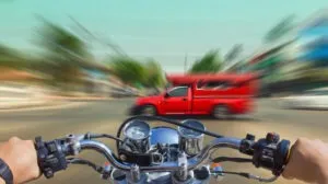 speeding-motorcycle-about-to-hit-a-truck