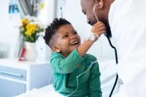 black-child-playing-with-his-doctor