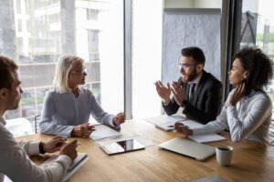 clients and lawyers working toward a settlement