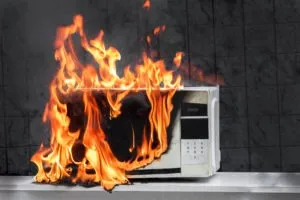 https://cdn.powa.com/www.vilesandbeckman.com/images/wp-content/uploads/2022/10/defective-microwave-house-product-appliance-on-fire-300x200-390-critical-mobile.jpg.webp