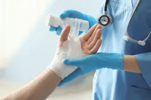 A nurse wraps a burn injury. Contact a North Fort Myers burn injury lawyer.