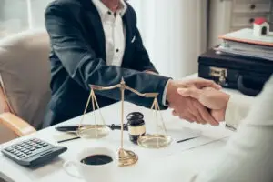 A Business Lawyer Shaking Hands With A Client
