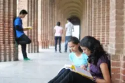 students-studying-in-college-hallway