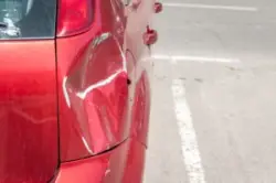 classic red car with a scratch