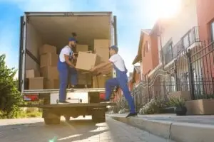 movers unloading boxes from truck