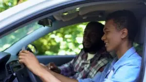 black-teen-driver-with-dad