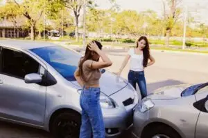 female drivers discussing crash