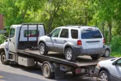 tow truck loading multiple cars