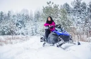 woman on snowmobile