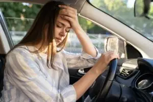 woman with headache after head-on crash