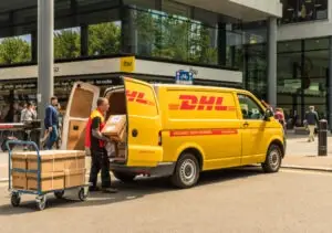 driver loading DHL truck