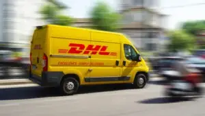 DHL truck speeding through traffic