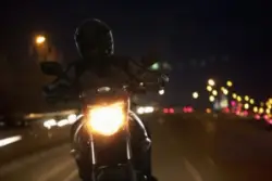 man on motorcycle at night