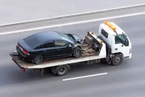 car on tow truck after crash