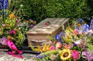 coffin in a field of flowers in bloomfield