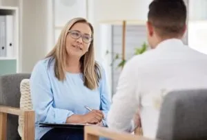 therapist talking to her patient