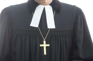 A clergy member wearing a cross. Can a clergy abuse lawyer help if my abuse happened years ago?