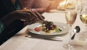 A woman eating. White Law PLLC attends Child USA 2024 Gala.