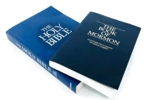 The Book of Mormon on top of the bible. What are your rights in Mormon Church sexual abuse claims?