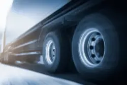 Speed,motion,blur,of,trailer,truck,driving,on,road