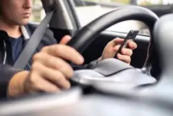 A rideshare driver using their app could cause a distracted driving accident