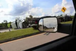 Overturned truck cab on highway