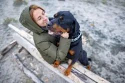 Happy woman with rottweiler