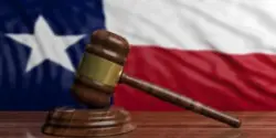 Gavel in front of texas flag
